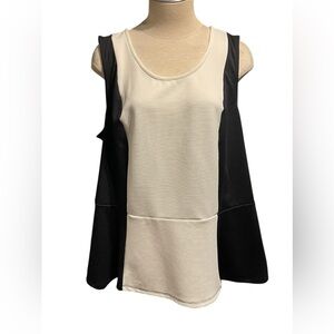PURE ENERGY: Black and White Sleeveless Peplum Top
